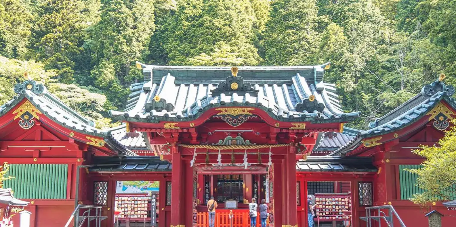 Ornate shrine building beneath trees