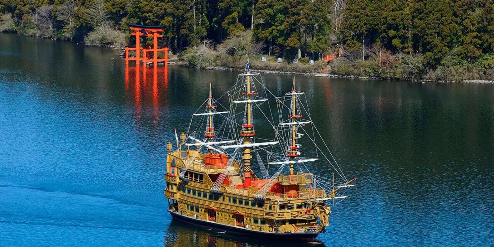Sightseeing ship near Hakone Shrine’s lakeside torii