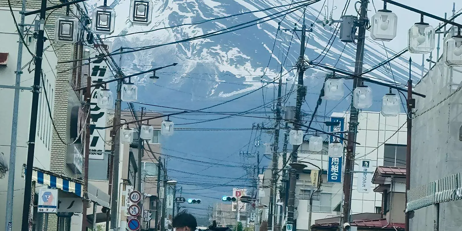 Mount Fuji beyond a town street